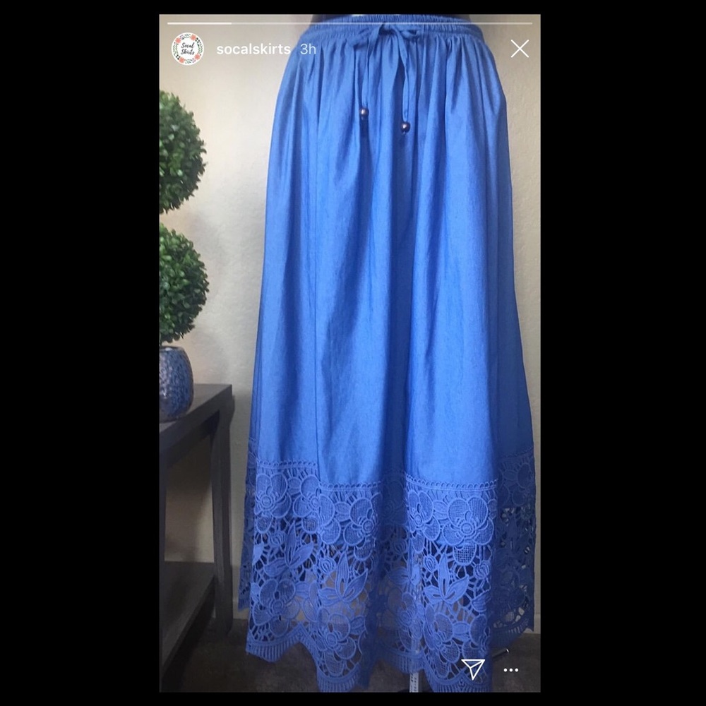 Blue maxi skirt with floral hem pattern